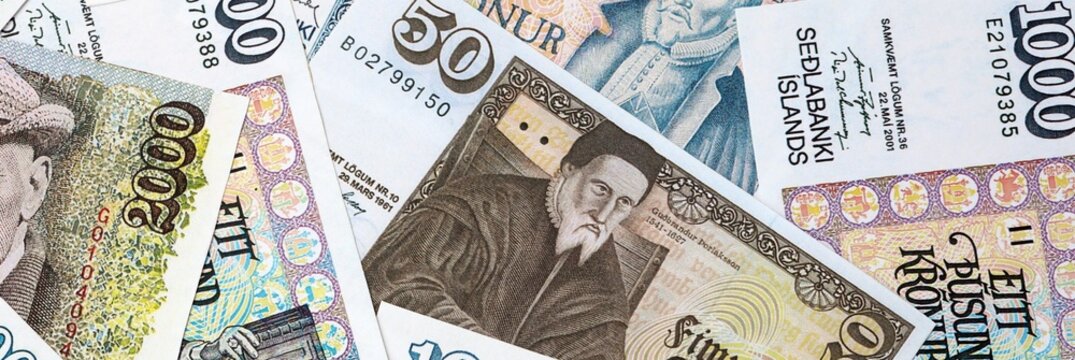 Icelandic krona money bills in pile on table. Iceland ISK currency cash close up