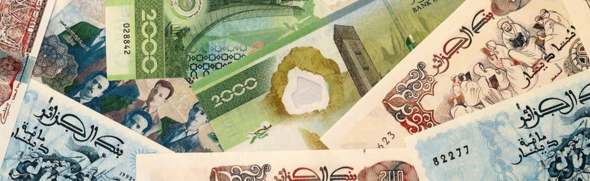 Algerian dinar money bills in pile on table. Algeria DZD currency cash close up