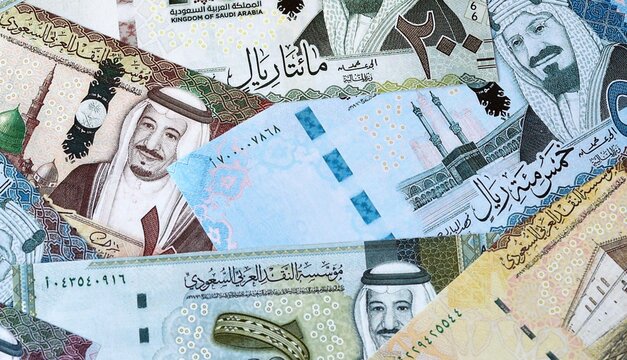 Saudi riyal money bills in pile. Big amount of Saudi Arabia SAR currency cash close up