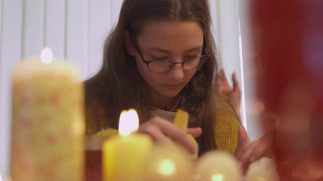 Friends taste homemade cookies while relaxing at a colorful Christmas table during the holiday season. Close candid view presents authentic festive enjoyment with strong commercial appeal.