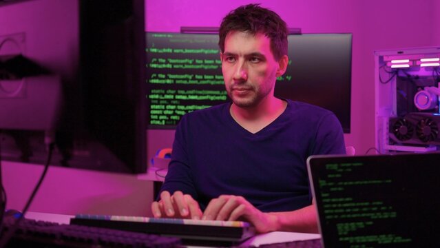 Solo software engineer working through technical issues late at night. Dedicated coder in dim lighting diagnosing problems on open computer case with intense concentration