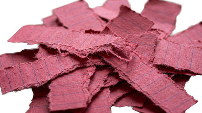 Red paper strips lie scattered on a clean transparent background surface.
