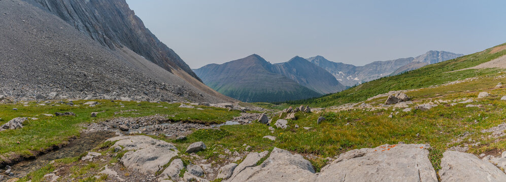 Scenic panoramic landscape of rugged mountain slopes, scree fields, and subarctic alpine tundra at Ptarmigan Cirque in Peter Lougheed Provincial Park. Near Banff National Park in summertime, stunning 