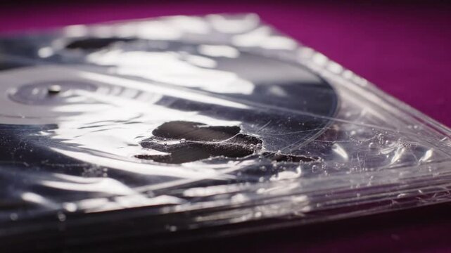 Unboxing and Opening a Sealed New Black Vinyl Record Album with Protective Plastic Packaging Close Up