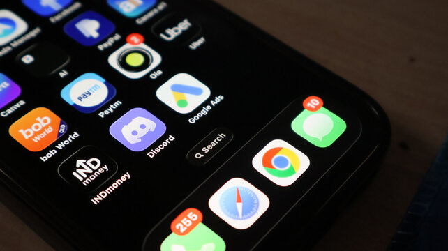 Modern smartphone interface showing various mobile app icons and red notification alerts.