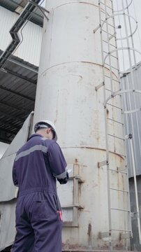 Engineering work using digital tablet maintenance Exhaust system concept Clean air environmental protection. Factory industrial manufacturing. Sustainable future environment air pollution reduction
