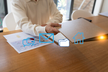 Business professional handing over a document folder at an office desk with digital communication, email, file and home icons, representing document management, information sharing, digital workflow. © Teelapon