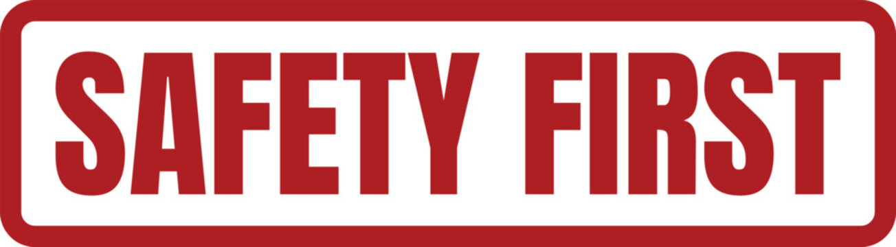 Bold red stamp impression with the text safety first used for industrial warning and compliance signage