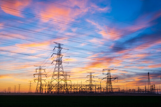 The pylons are in the evening, Substation in the evening, High voltage substation and beautiful sunset glow