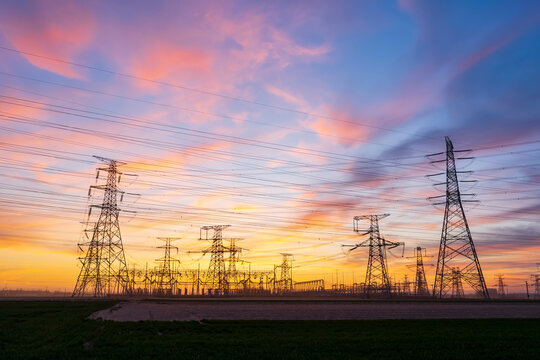 The pylons are in the evening, Substation in the evening, High voltage substation and beautiful sunset glow