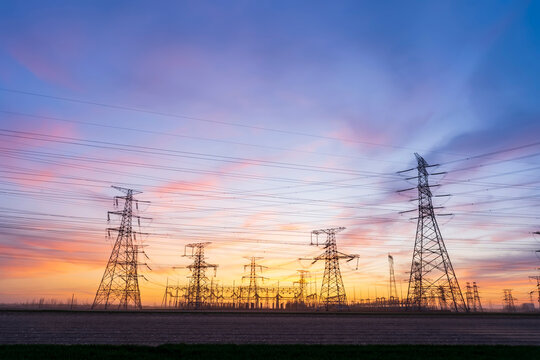 The pylons are in the evening, Substation in the evening, High voltage substation and beautiful sunset glow