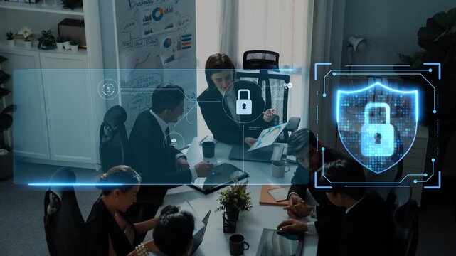 A business team engages in a meeting within a modern office, highlighting discussions on digital security solutions and data protection strategies using advanced technology. Raster