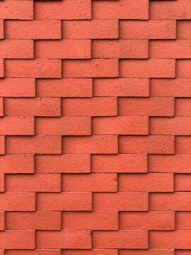 Minimalist red clay brick tile wall texture background, rustic masonry surface with clean pattern for architecture and interior use