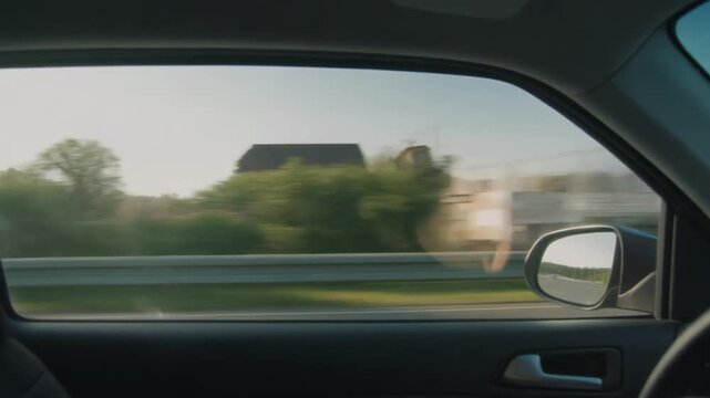driving on the road in motion side view scene from the front passenger seat