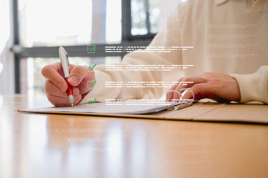 Businessman using pen, completing checklist on document in data system Report HR technology Concept, A checklist for policy implementation featuring a standard and official approved documents