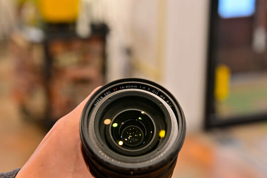 Close-up of Fujifilm XT5 camera lens held in hand