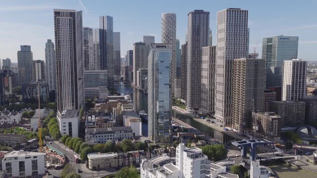 Establishing aerial view of Canary Wharf financial district on the Isle of Dogs in London. UK economy and service sector concept