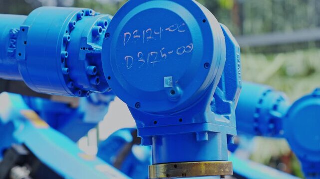 Industrial blue valve pipeline mechanical equipment, water infrastructure machinery, automated factory robot housings, metal engineering components, outdoor treatment facility flow control technology