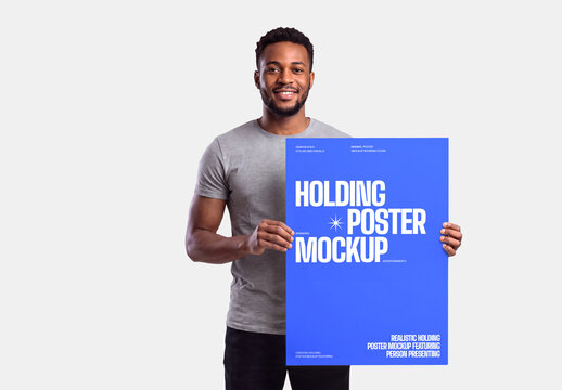 Man Holding Poster Mockup for Advertising Design
