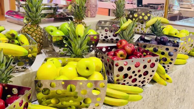 Fresh apples inside strawberry shaped stand and assorted fruits at luxury five stars Sharm El Sheikh resort all inclusive buffet in Egypt. Premium healthy fruit detox catering on Sinai Peninsula.
