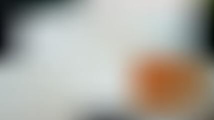 Obraz premium Blurred orange and white gradient background, texture