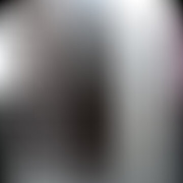 Dark gradient background, with blurred light spot