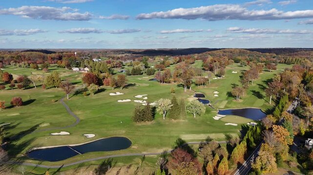 Aerial View of a Golf Course in Autumn with Colorful Fall Foliage in Greenville, Delaware