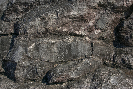A close-up view revealing the shape, color, and texture of karst rock&mdash;which has weathered over centuries to a blackish-gray hue&mdash;making it highly relevant for research in geology