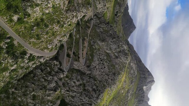 Dramatic aerial view of Sa Calobra road in Mallorca. Travel, landmark and nature vertical footage