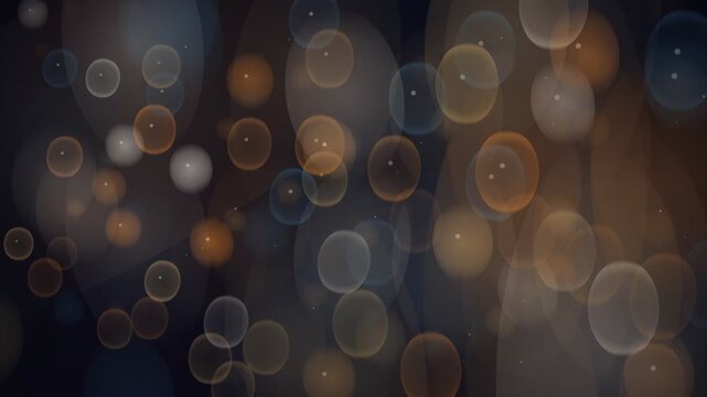 Abstract bokeh lights in warm tones, creating a dreamy and atmospheric background effect.