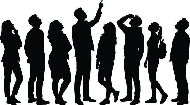 Black silhouettes of a diverse group of people looking and pointing up isolated on white background