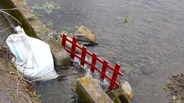 Water Flowing from Irrigation Canal into Rice Paddy Field in Rural Japan
