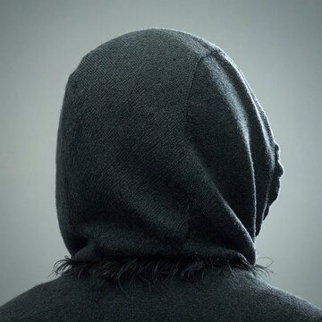 Dark Hooded Figure from Behind on Grey Background Concept