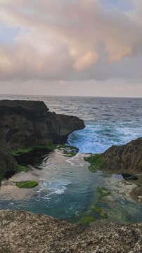 Scenic rocky coastline with ocean waves and tidal pool