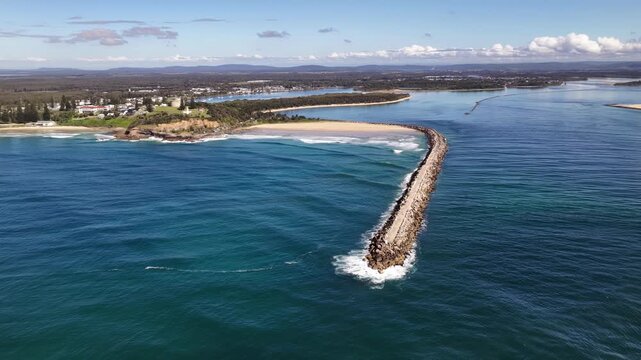 Aerial video of the breakwalls at the Clarence River entrance, with the Pacific Ocean stretching along Yamba&rsquo;s coastline.