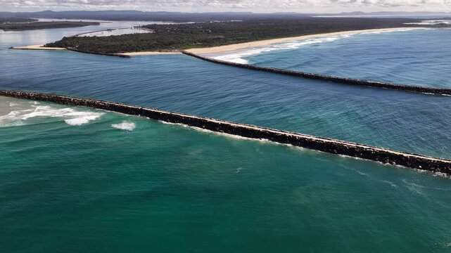Aerial video of the breakwalls at the Clarence River entrance, with the Pacific Ocean stretching along Yamba&rsquo;s coastline.