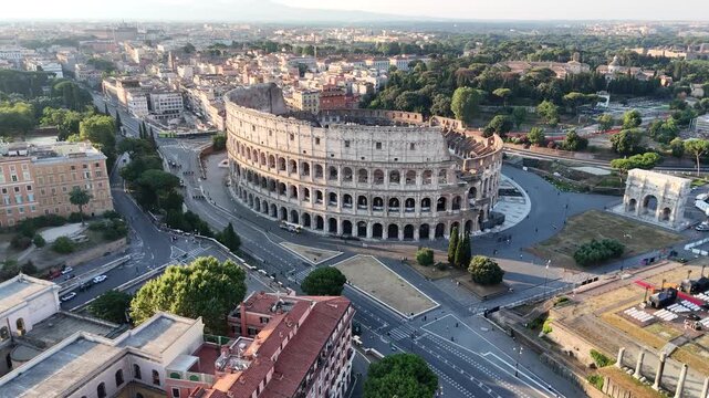 Rome, Italy - June 27, 2026: Aerial drone flight moving forward over the ancient Colosseum amphitheater during daytime