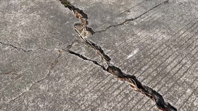 Deep crack on concrete road surface texture abstract background