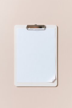 Clipboard with a blank sheet of plain paper, featuring a smooth matte texture and professional layout for checklists and form mockups