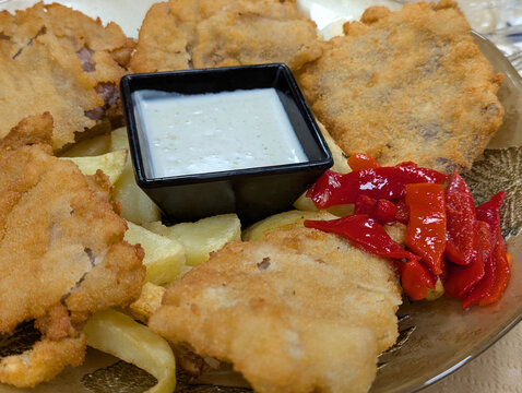 Breaded veal escalopes with Cabrales blue cheese sauce, roasted piquillo peppers and fried potatoes, traditional Asturian dish, Nava, Asturias, Comarca de la Sidra, Spain