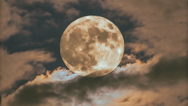 Full moon glowing in the night sky with dark clouds isolated on transparent