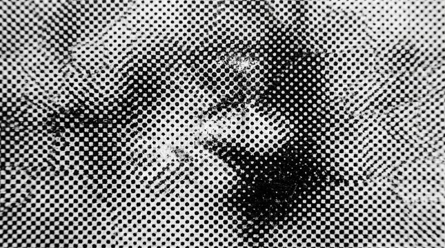 Black and white halftone dot pattern texture on a printed paper surface close with texture created printing