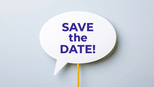 A speech bubble sign with the text save the date against a light background. Wedding invitation concept for event planning.