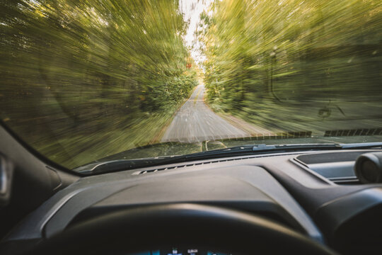Point of view driving fast on a rural road