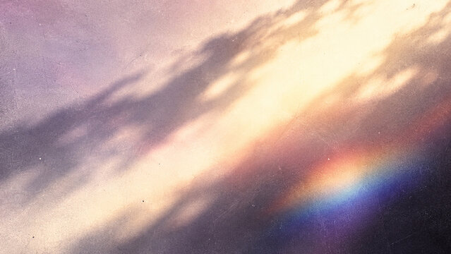 Pastel sky clouds and rainbow prism light overlay soft dreamy background