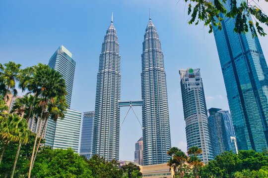 

KUALA LUMPUR, MALAYSIA - SEPTEMBERER 14, 2025: Petronas Towers. Petronas Towers, also known as Menara Petronas is the tallest buildings in the world from 1998 to 2004. On a hot day during wet season