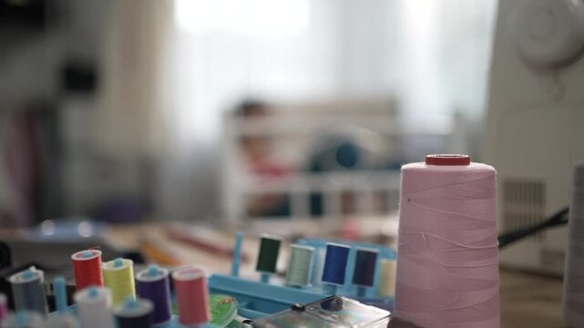 Colorful Thread Spools in Tailor Shop Workshop
