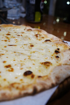 Crispy thin crust gorgonzola cheese pizza served with sweet honey