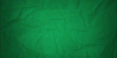 Obraz premium A background made of crumpled green paper