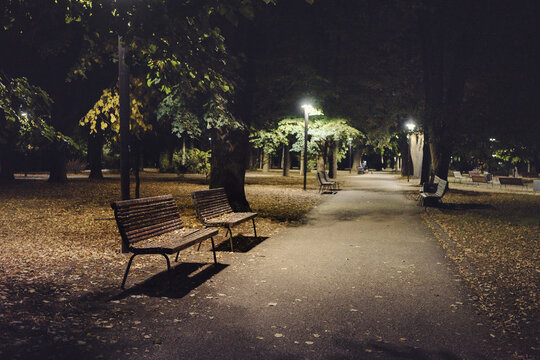 Dirty benches in the park, the beginning of autumn at night